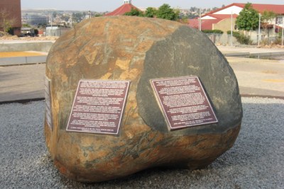 A monument laid before the Hector Pieterson Museum in Soweto. Pieterson became the subject of an iconic image of the 1976 Soweto uprising when a news photograph by Sam Nzima of the dying boy, being carried by another student while his sister ran next to them, was published around the world.