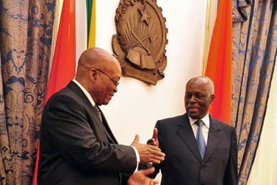 President Jacob Zuma of South Africa greets President José Eduardo dos Santos of Angola, during Zuma's first official state visit to a foreign country.