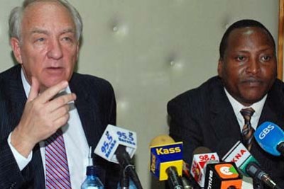 U.S. war crimes envoy Stephen Rapp, left, and assistant Kenyan minister Richard Onyonka discussing the International Criminal Court's probe into post-election violence.