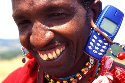 Kenya: A pastoralist Maasai shows off his mobile phone.