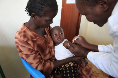 Trial participant being vaccinated, Siaya District hospital, by the PATH Malaria Vaccine Initiative.