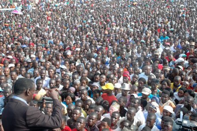 Opposition leader Kizza Besigye addresses a rally in Kazo on Tuesday. In the 2006 elections President Yoweri Museveni beat Besigye to the Buganda vote.