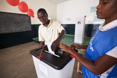 A voter casts his ballot in Liberias constitutional referendum.