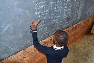 A pupil works alone at a primary school tutors her classmates on September 6, 2011, as teachers across the country downed their tools for a second day.