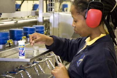 Keneuwe Monakale tests water quality at a South African brewery.