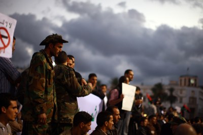 A crowd of demonstrators protest the ongoing use of weapons by rebel militias inside of Tripoli (file photo).