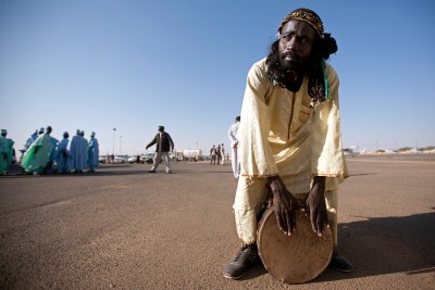Darfuri Drummer Greets Diplomatic Delegation
