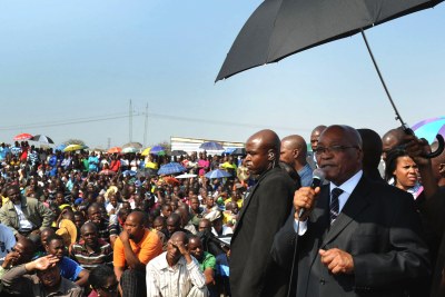 President Jacob Zuma is seen addressing striking Marikana miners at Lonmin's platinum mine.