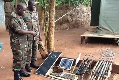 Ugandan military officers survey the ammunition captured from the Lord's Resistance Army.