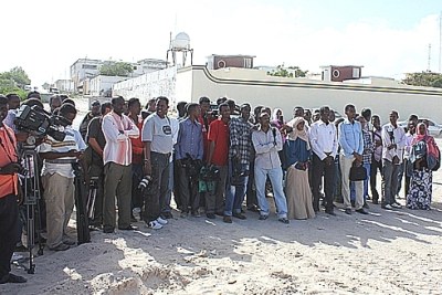 Journalists attending the burial of their murdered colleagues.