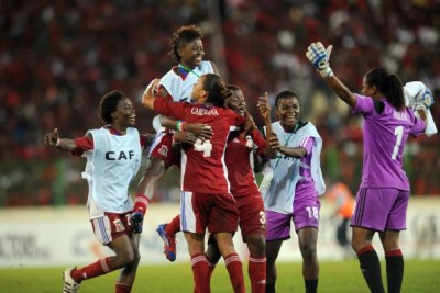 Equatorial Guinea women's soccer team celebrating.