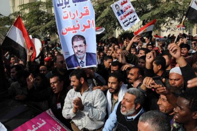 Supporters of Egyptian President Mohamed Morsi gather outside the Supreme Constitutional Court during a protest in Cairo, Egypt, Dec. 2, 2012. Egypt's Supreme Constitutional Court suspended its work on Sunday, following protests against the court.