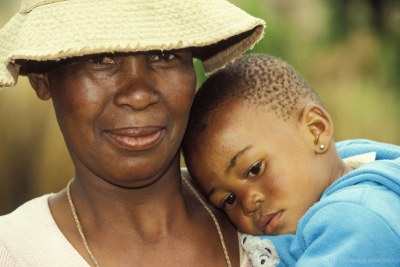 A woman holds her baby in Botswana.