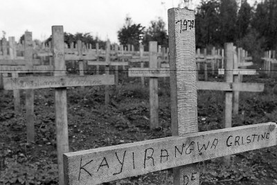 Crosses mark the mass grave of an estimated 600 civilians killed nearby during the genocide.
