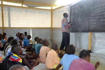 A class at one of Unicef's temporary learning spaces in Bangui at the Boy Rabe monastery site.
