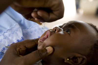 Aan infant receives a dose of oral polio vaccine (file photo).