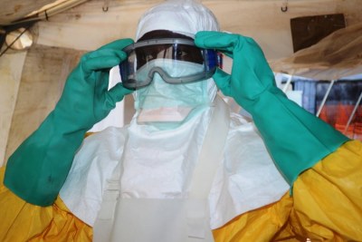 A doctor preparing to treat patients diagnosed with Ebola in Nigeria.
