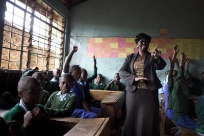 Deputy Head teacher Margaret Atieno Ochieng teach a class of eight pupils at ehe Kibera Primary School.