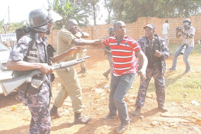 Christopher Aine being arrested in Jinja in 2015.