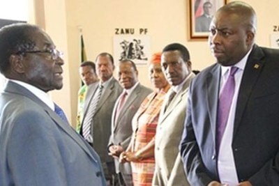 President Robert Mugabe with Saviour Kasukuwere.