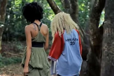 Two women walk side-by-side in a YouTube screengrab from the controversial Same Love remix music video.