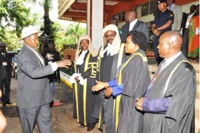 President Museveni is received by Speaker Rebecca Kadaga, her Deputy Jacob Oulanyah and the Clerk to Parliament Jane Kibirige during the State-of-the Nation address.