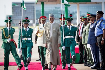 President Muhammadu Buhari welcomed by the Presidential Guards of Honour.