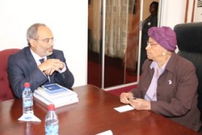 President Sirleaf chats with Dr. Lopez.