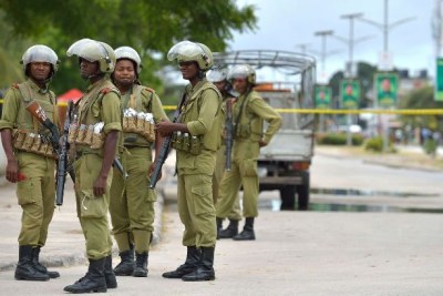 Some members of the aniti-riot Field Force Unit (FFU) stand attentively on one of Dar es Salaam highways. Both police and politicians are advised to engage in a dialogue to avoid a breach of the peace on September 1 (file photo).