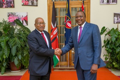 South African president Jacob Zuma, left, shakes hands with Kenyan president Uhuru Kenyatta, right.
