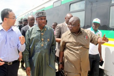 Minister of Transportation Chibuike Rotimi Amaechi, (middle) with the Managing Director, China Civil Engineering Construction Corporation Ltd. (CCECC) Jack Li (left) and Fidel Okhiria, Acting Managing Director of the Nigerian Railway Corporation (right) during the test run of the recently built Rail line from Abuja (Idu) to Kaduna