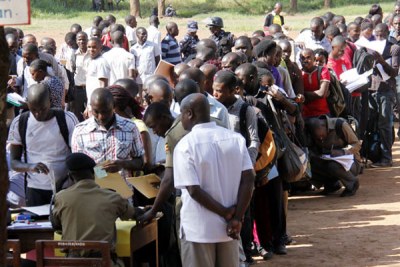 Job seekers register for police recruitment in Kampala. Many Ugandans are believed to prefer working abroad because it is said they earn better salaries there.
