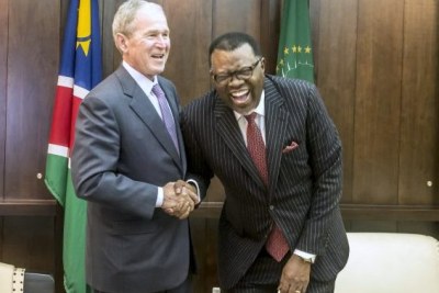 President Hage Geingob shares a laugh while hosting former U.S. President George W. Bush in Namibia.
