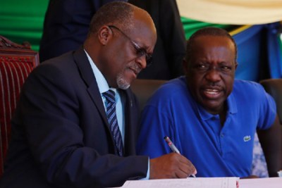 President John Magufuli and his friend energy and mineral minister Prof Sospeter Muhongo.