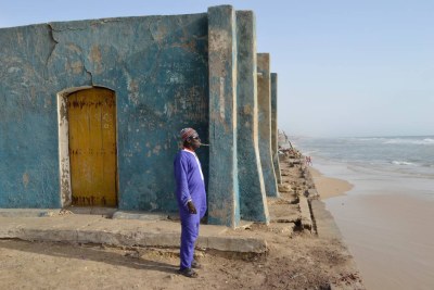 Cheikh Badiane, 54, looks out to sea from the edge of the fishing district of Guet Ndar, in the northern city of Saint-Louis, Senegal, May 1, 2017.