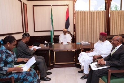 Buhari with Ministers of Budget, Finance, and the Governor of the Central Bank.