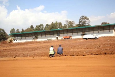 Construction workers at the Kinoru stadium in Meru last week. The stadium was one of five others chosen to host the African Nations Championship (CHAN) games but Kenya was at the weekend stripped of her rights to manage the event, which will start in January. African football chiefs said Kenya was not prepared for the 16-nation showpiece because the stadiums are incomplete.
