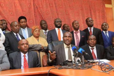 ODM chairperson John Mbadi (centre) addresses journalists after a Nasa parliamentary group meeting on October 10, 2017.
