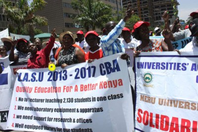 Members of the Universities Staff Academic Union protest at Harambee Avenue.