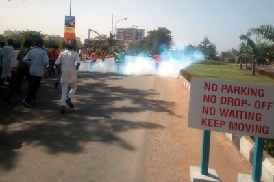 Police attack protesting Shiites with tear gas.