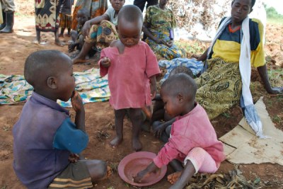Children share food at Nakivale Refugee Camp in the Isingiro district (file photo).