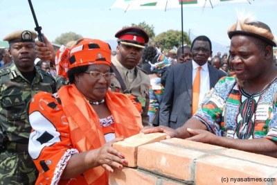 Former President Joyce Banda laying a foundation stone.(file photo).