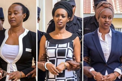 Adeline Rwigara (left) and her daughters Diane Rwigara (centre) and Anne Rwigara are escorted by security officers to a police van after a Kigali court adjourned the pre-trial hearing in which they are facing criminal charges on October 9, 2017.