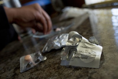 A patient takes her daily regimen for extensively drug-resistant tuberculosis (file photo).