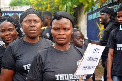 Women of the Lutheran Church in Liberia march against violence in the Thursdays in Black procession.