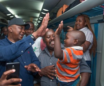 Hugs, Smiles and Selfies as Kenyatta Surprises Train Passengers