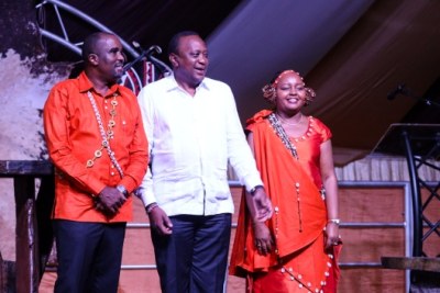 President Uhuru Kenyatta with the newly weds Governor Anne Mumbi and Kamotho Waiganjo during their traditional wedding ceremony.