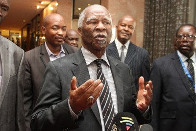 Former South African president Thabo Mbeki addresses journalists in Harare.