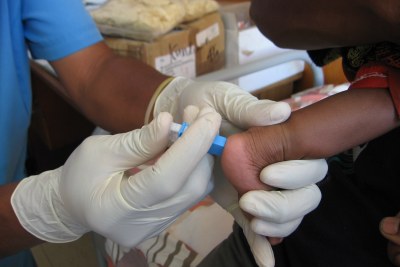 A blood spot test (for HIV) on an infant (file photo).