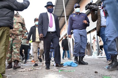 South African Minister of the Police Bheki Cele inspects damage at Pan African Mall in Alexandra on July 13, 2021.